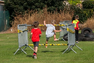 Children participating in a volunteer-supported outdoor sports activity